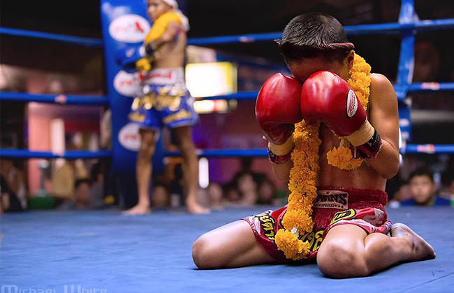 A Muay Thai fighter performing the Wai Khru before his fight.